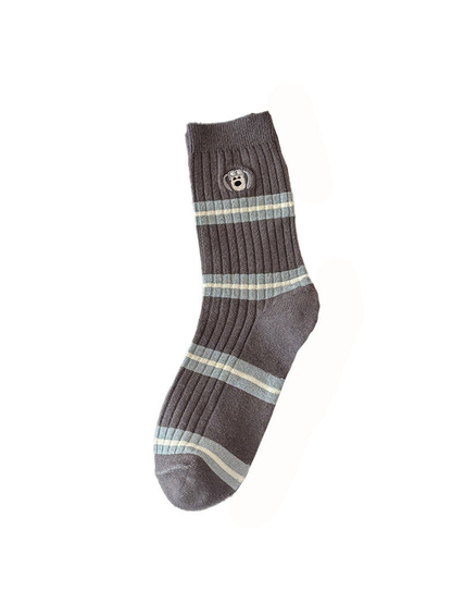 Goggle style dark gray ribbed crew sock with stripes and embroidered face