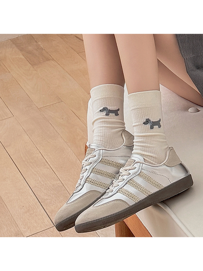 Ivory Dog crew socks worn with low-top sneakers