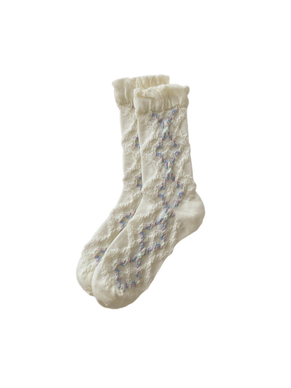 Ivory mid-calf socks with a ruffled cuff and openwork diamond pattern