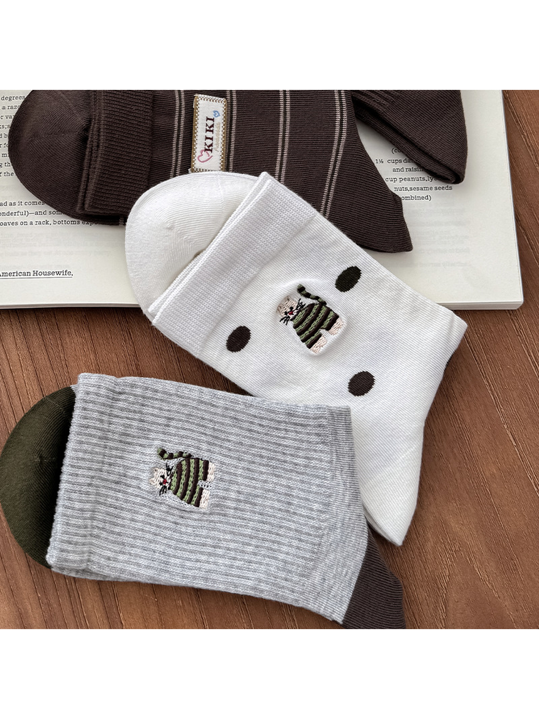Polka Dot and Heather Gray crew socks arranged with brown styles