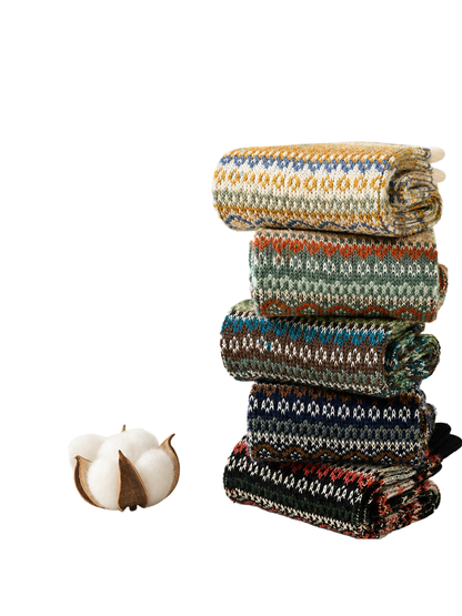 Rolled geometric patterned crew socks stacked in five colors