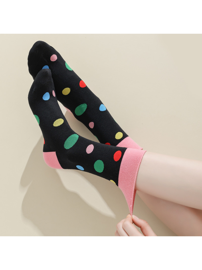 Close-up of the Pink Dots sock cuff being stretched