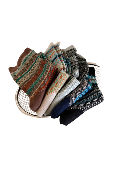 Multiple geometric crew sock colors arranged in a wire basket