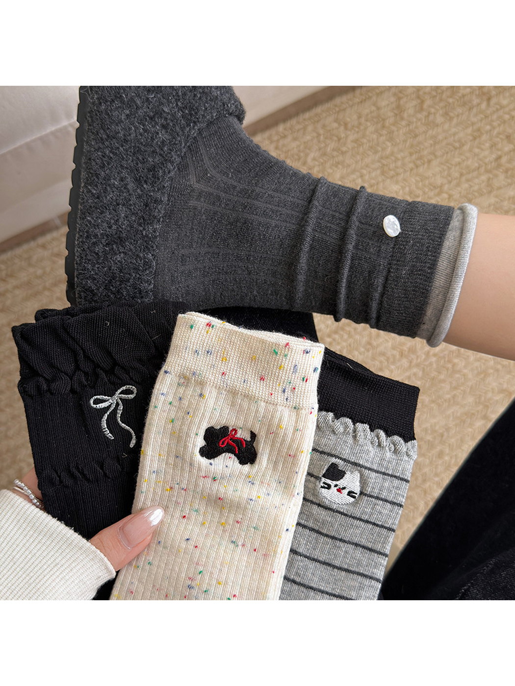 Multiple sock styles showing bow, cat, stripe and button details