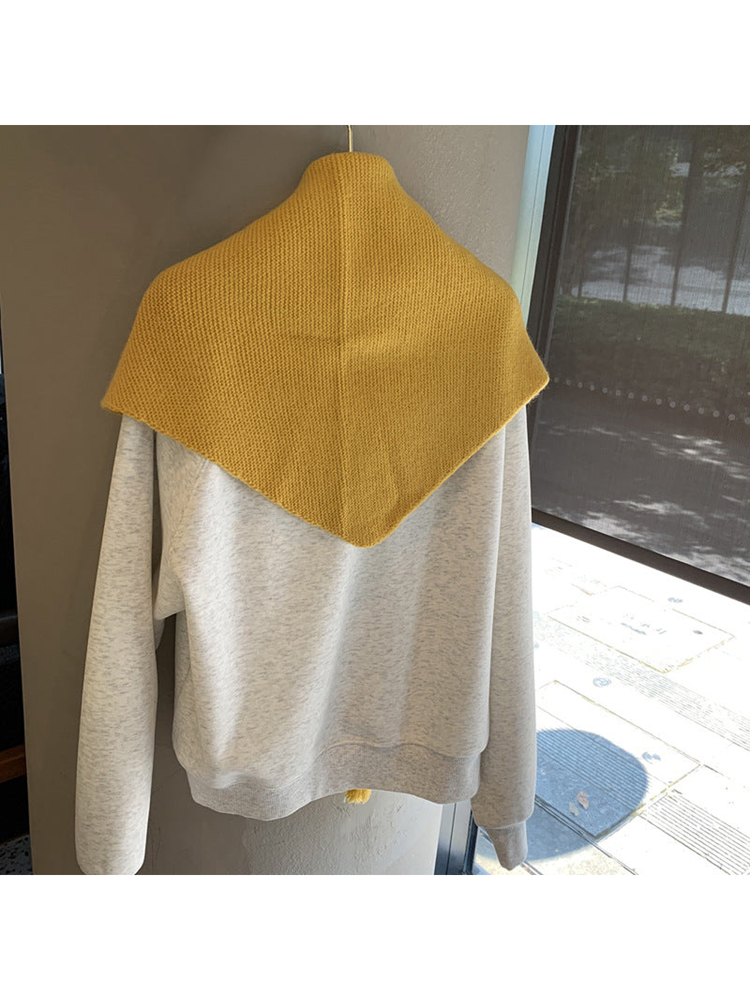Back view of the Mustard Yellow triangle scarf showing its pointed shape
