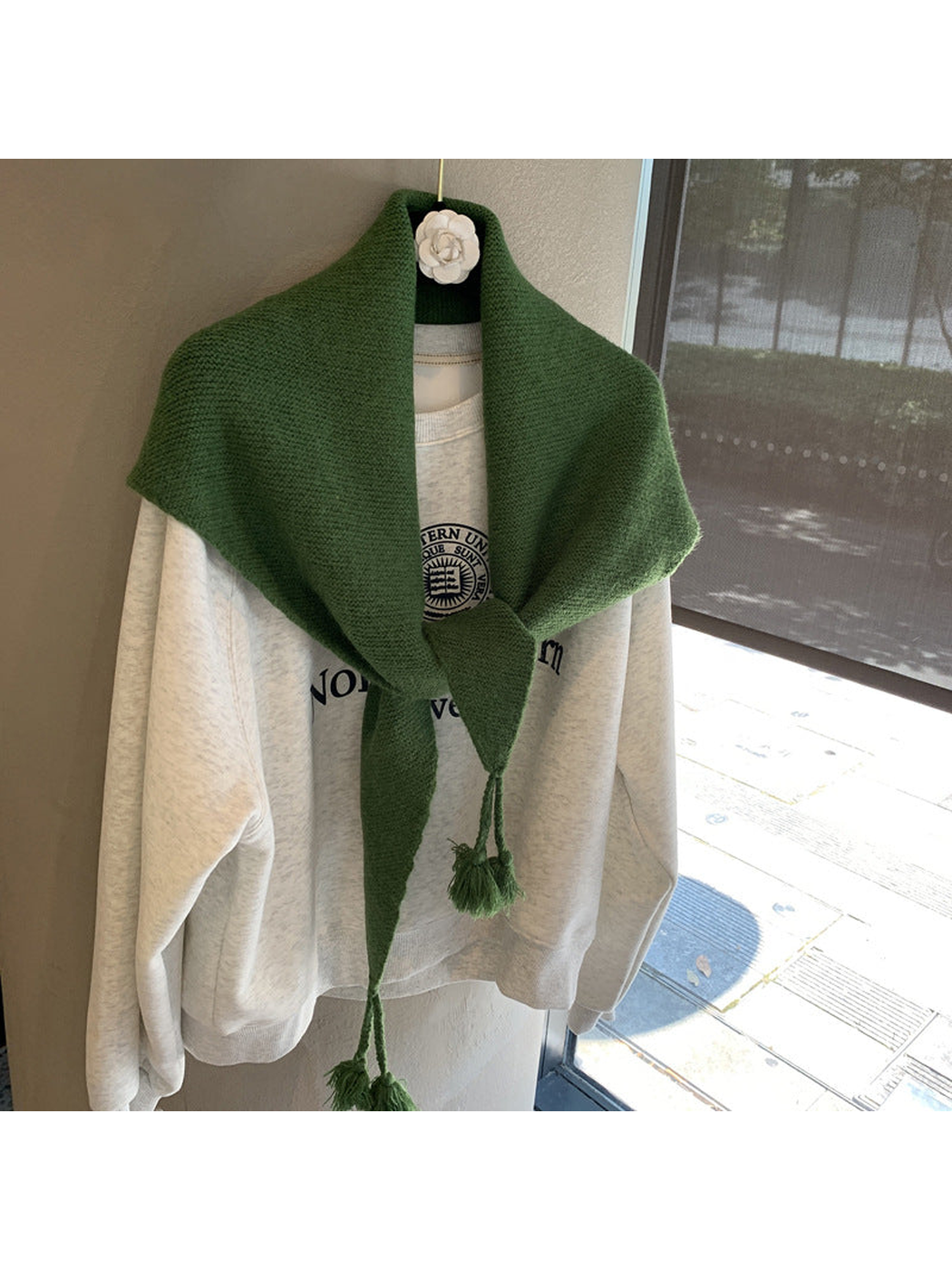 Dark Green textured triangle scarf tied with tasselled ends