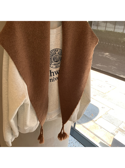Close-up of the Brown triangle scarf texture and tasselled ends