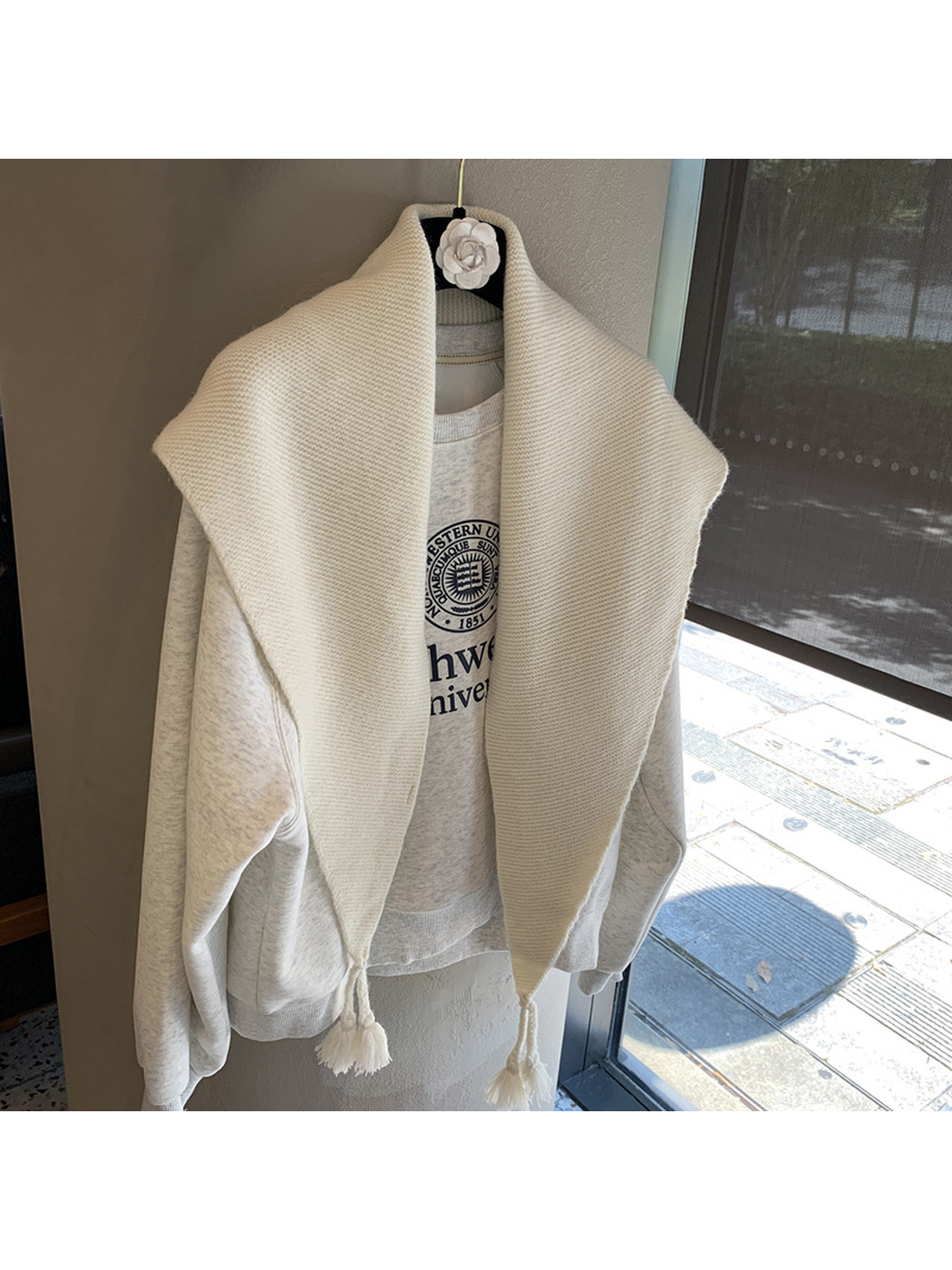 White textured triangle scarf with tassels, front view