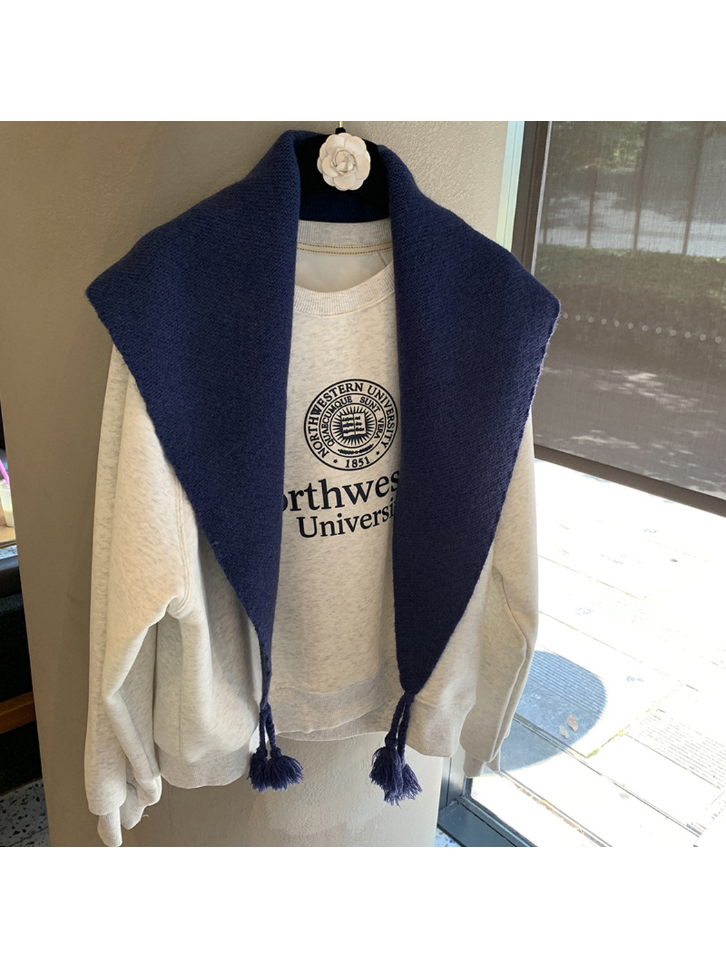 Navy textured triangle scarf with tassels, front view