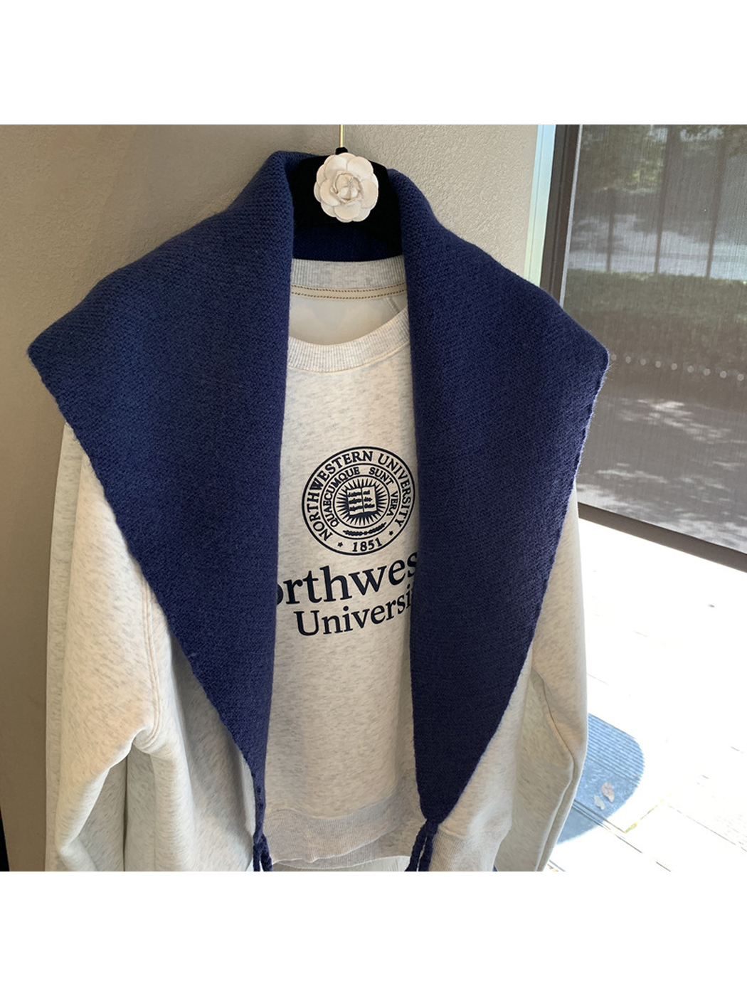 Close-up of the Navy triangle scarf's fine textured surface
