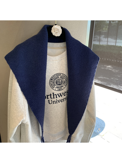 Close-up of the Navy triangle scarf's fine textured surface