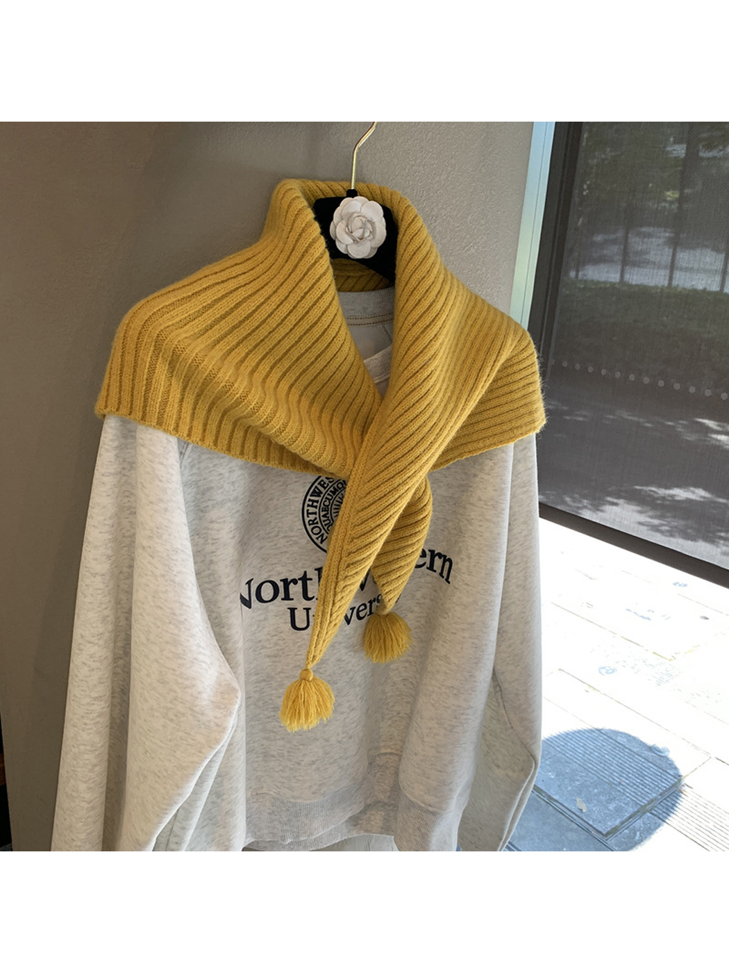 Mustard Yellow ribbed triangle scarf wrapped across the shoulders and crossed in front