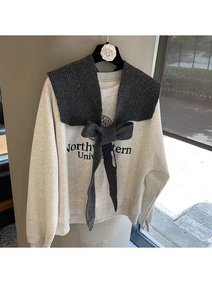 Dark Gray ribbed tie-front shoulder scarf styled in a bow
