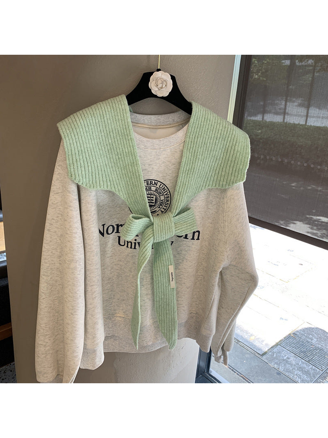 Mint ribbed tie-front shoulder scarf styled in a bow