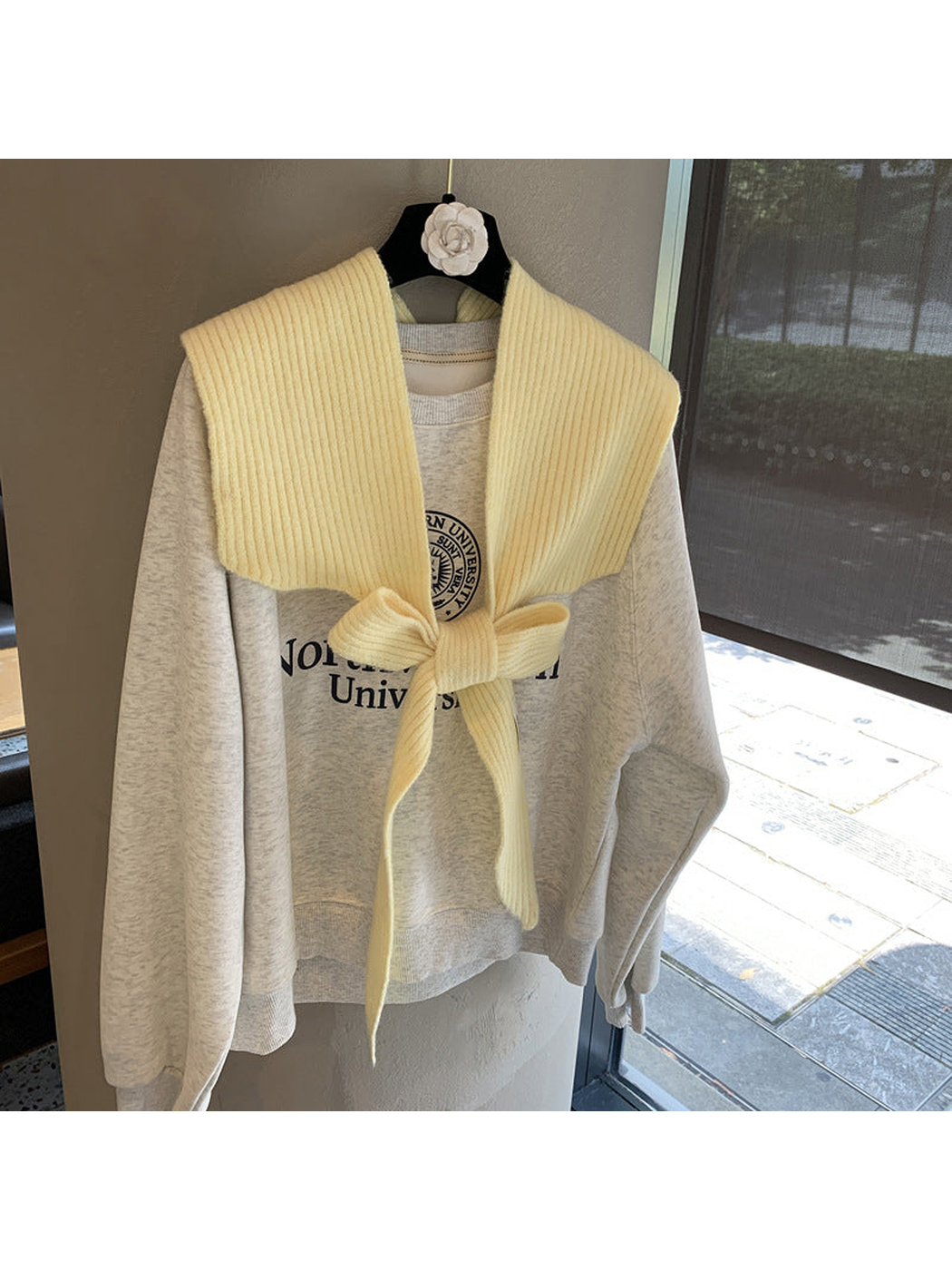 Yellow ribbed tie-front shoulder scarf styled in a bow