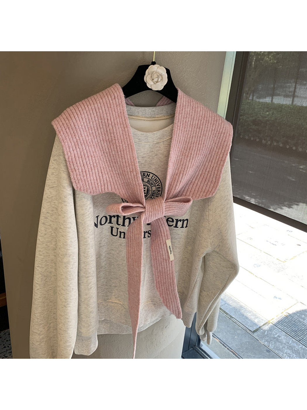 Dusty Pink ribbed tie-front shoulder scarf styled in a bow