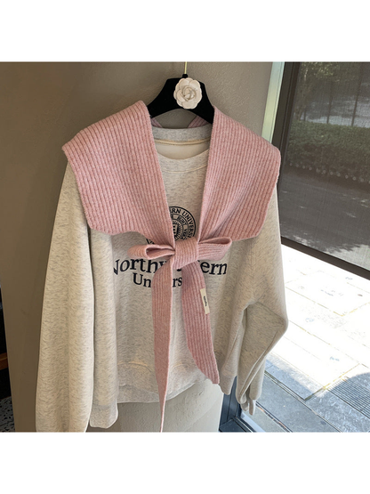 Dusty Pink ribbed tie-front shoulder scarf styled in a bow