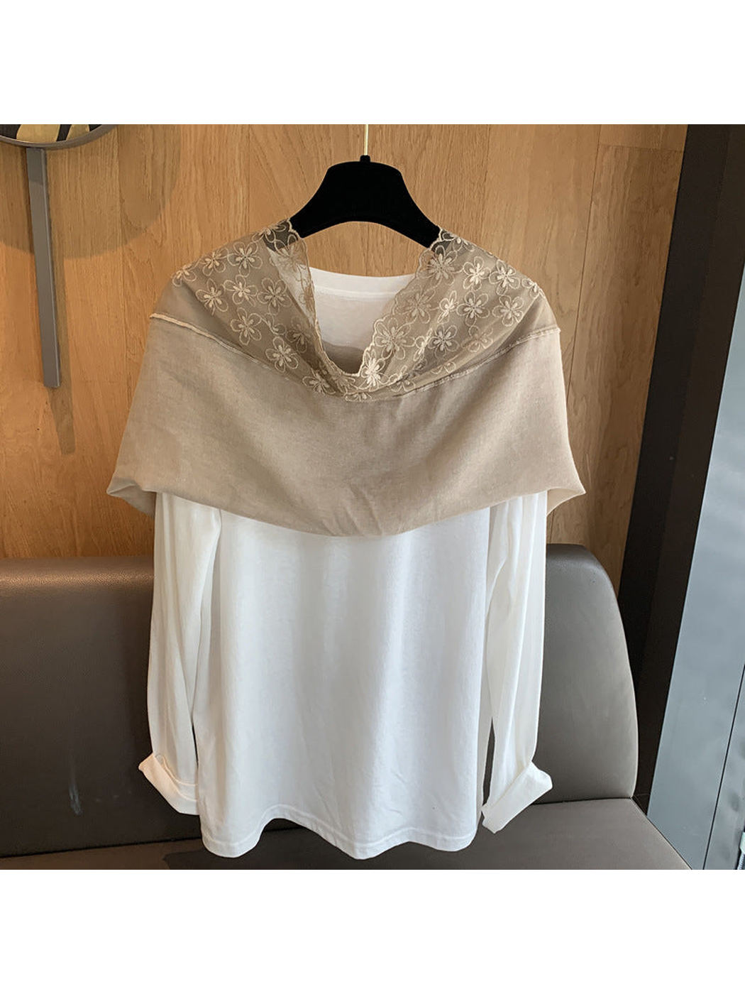 Greige floral-border scarf shown in a wide shoulder drape