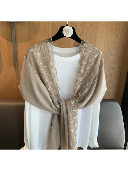 Close-up of the Greige scarf's sheer floral embroidery and scalloped trim