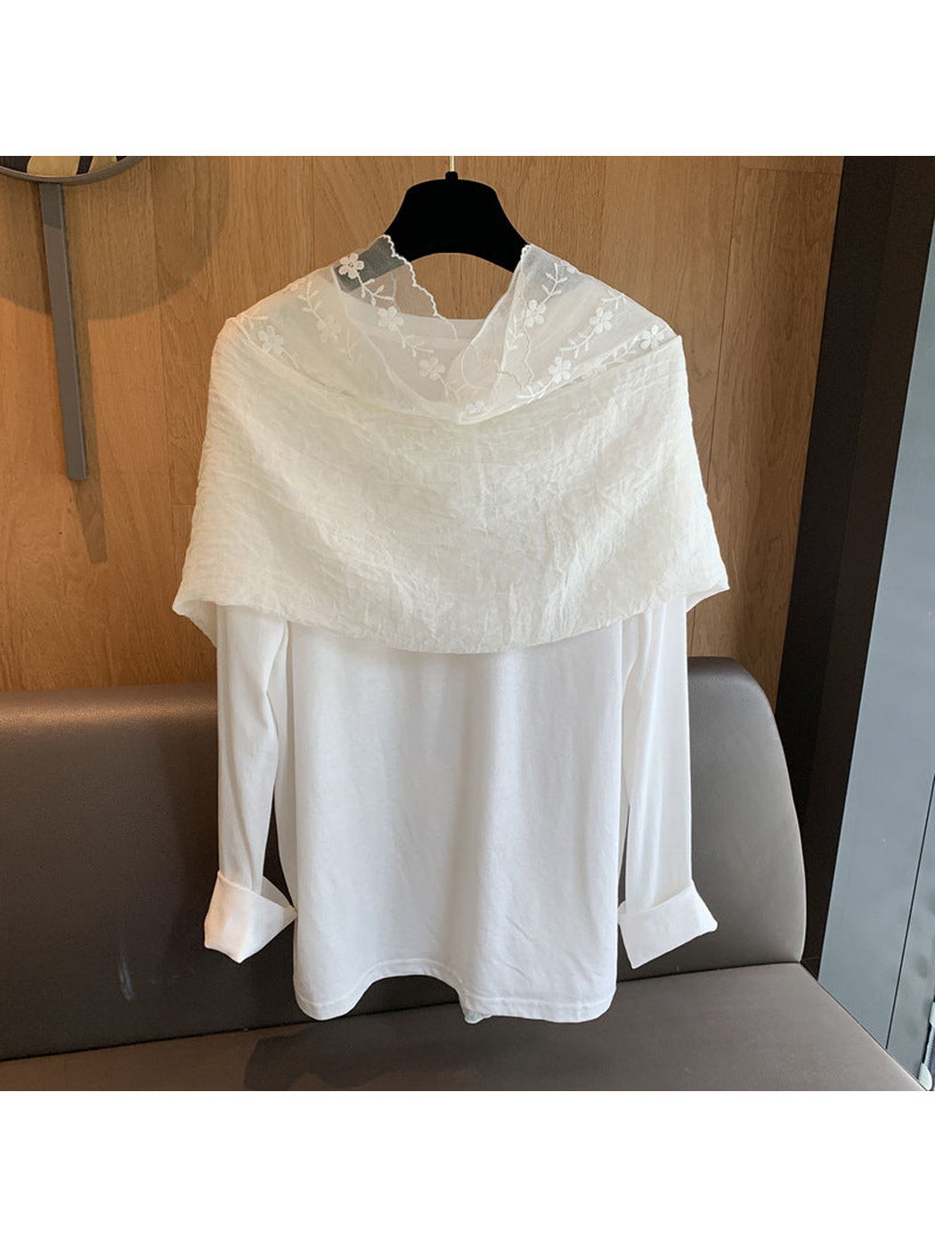 Ivory scarf wrapped across the shoulders, back view