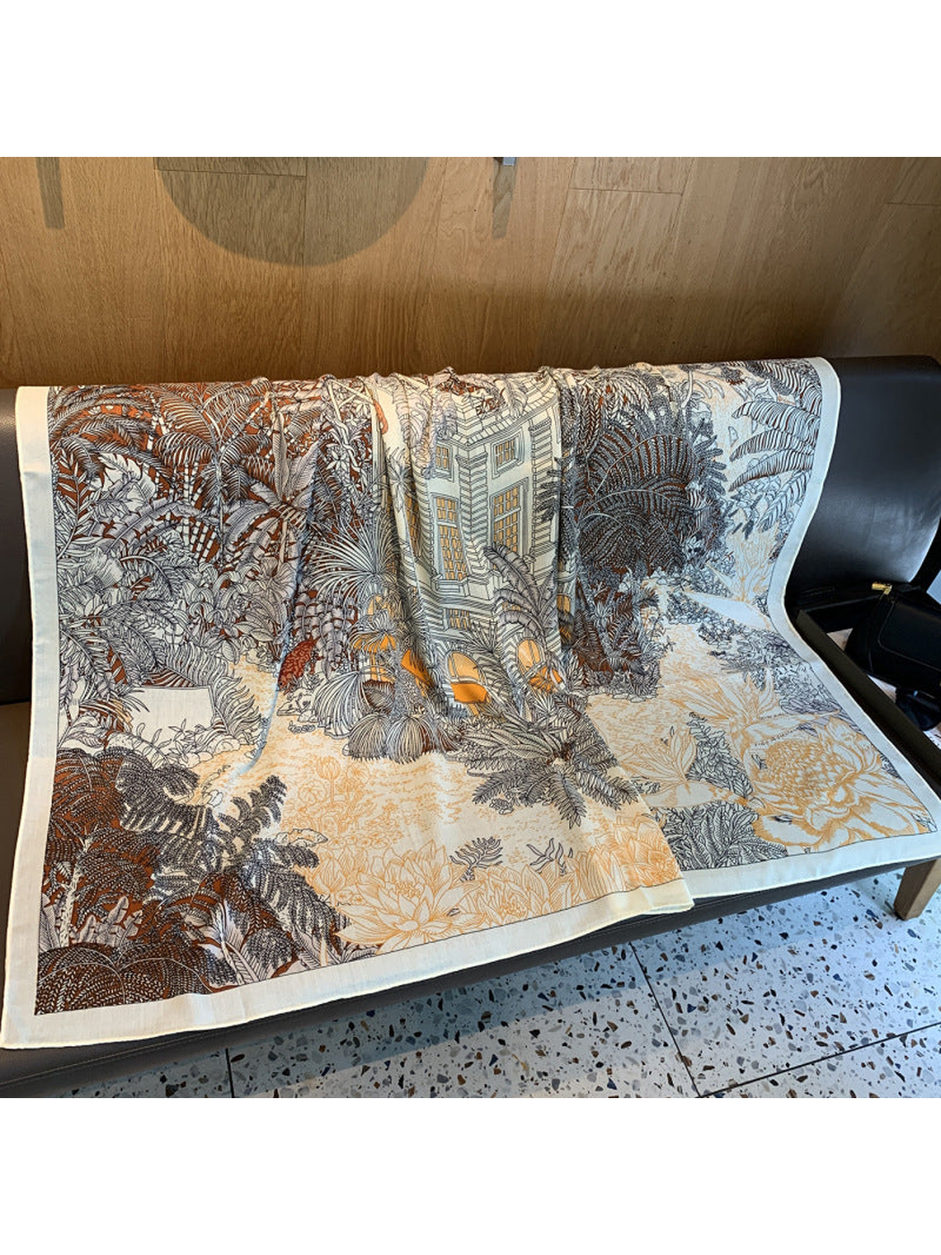 Square scarf spread open to show the botanical and architectural line-art print