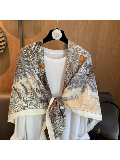 Close-up of the botanical line-art print and knotted scarf styling