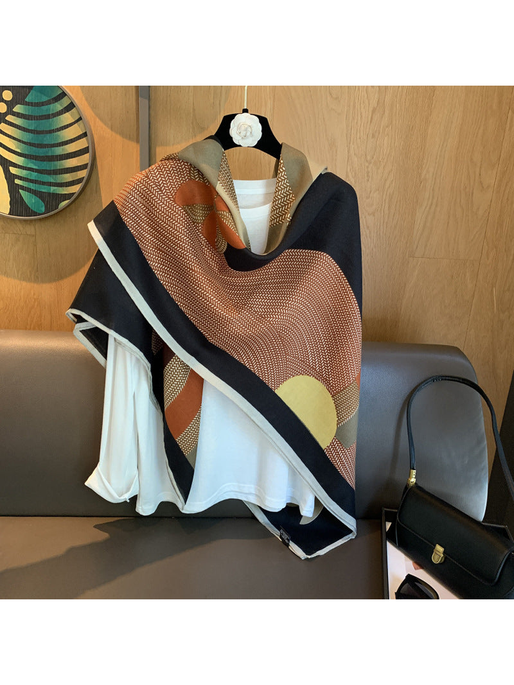 Multicolor abstract-pattern square scarf wrapped diagonally over a white top