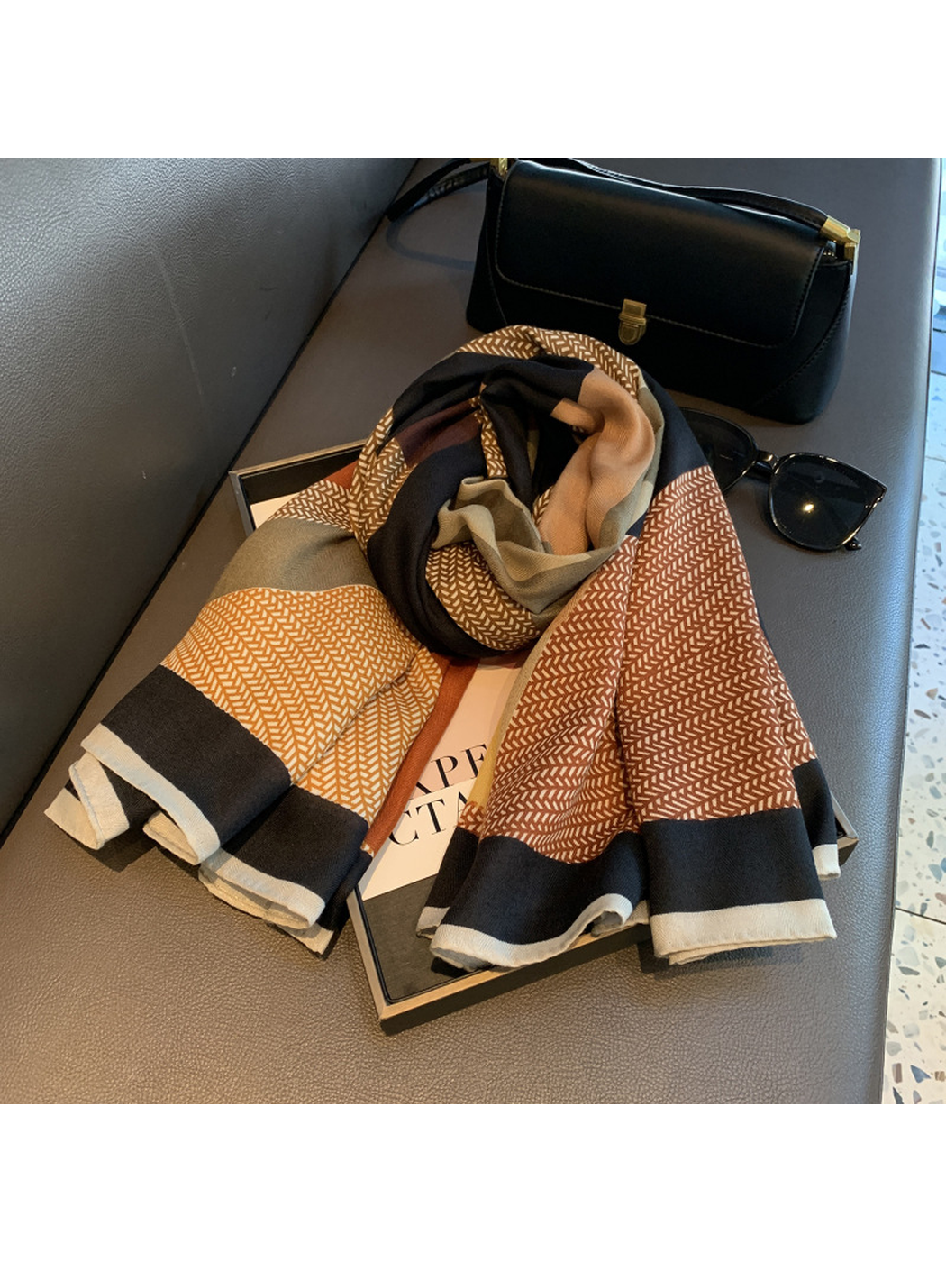 Rolled multicolor square scarf showing the fine patterned sections and dark border
