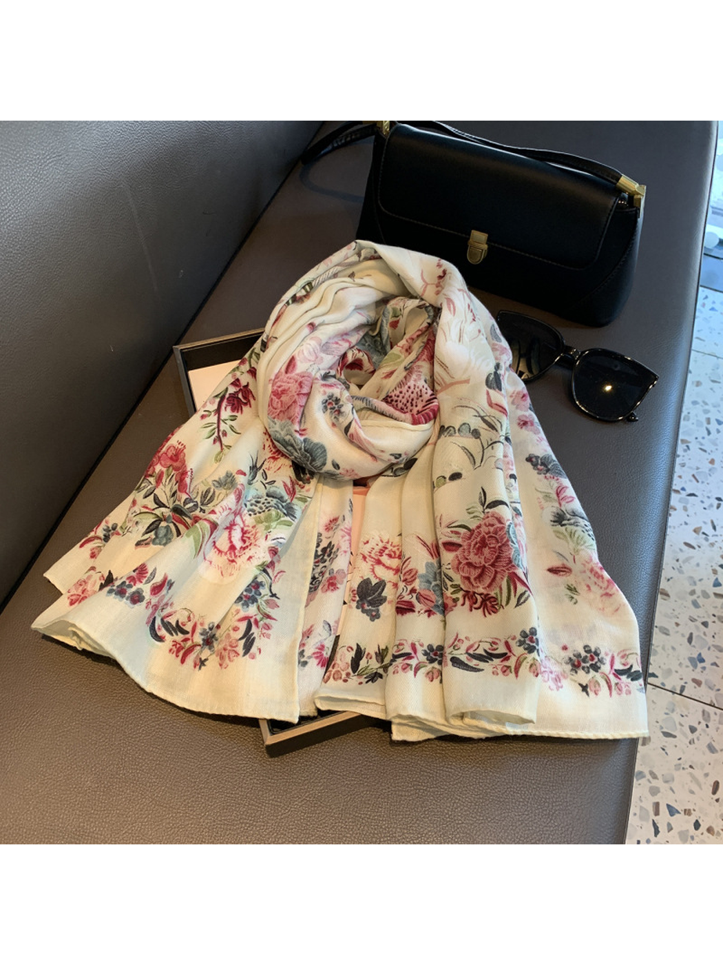 Close-up of ivory floral scarf with narrow finished edges