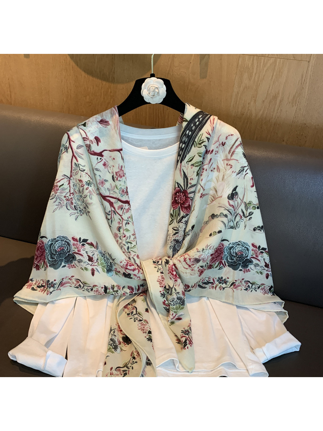 Ivory floral square scarf tied over a white top