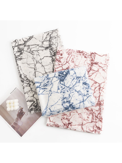Black Gray, Burgundy and Blue abstract-print scarves arranged on a white background