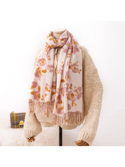 Pink and mustard floral scarf styled with a cream knit sweater