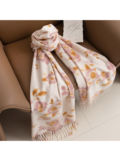 Pink and mustard floral scarf loosely knotted on a brown chair