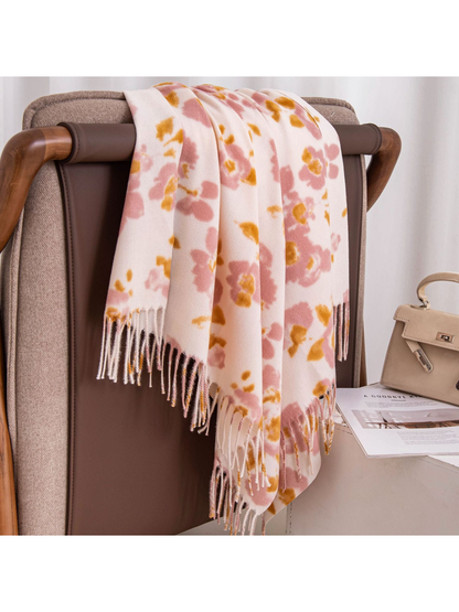 Pink and mustard floral scarf draped over a brown armchair