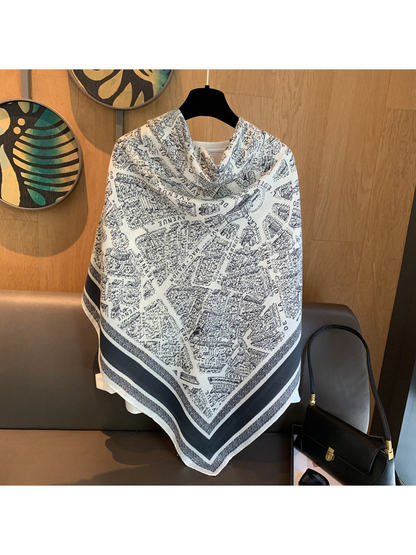 Ivory and navy square scarf displayed as a full front-covering shawl