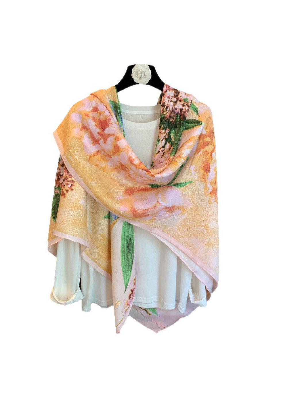 Multicolor floral square scarf draped over a white top