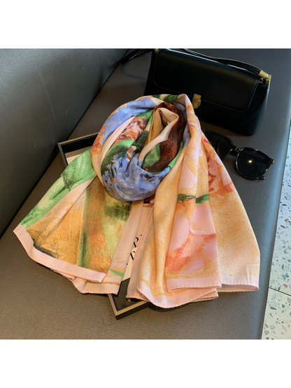 Folded floral scarf showing peach, blue and green print details