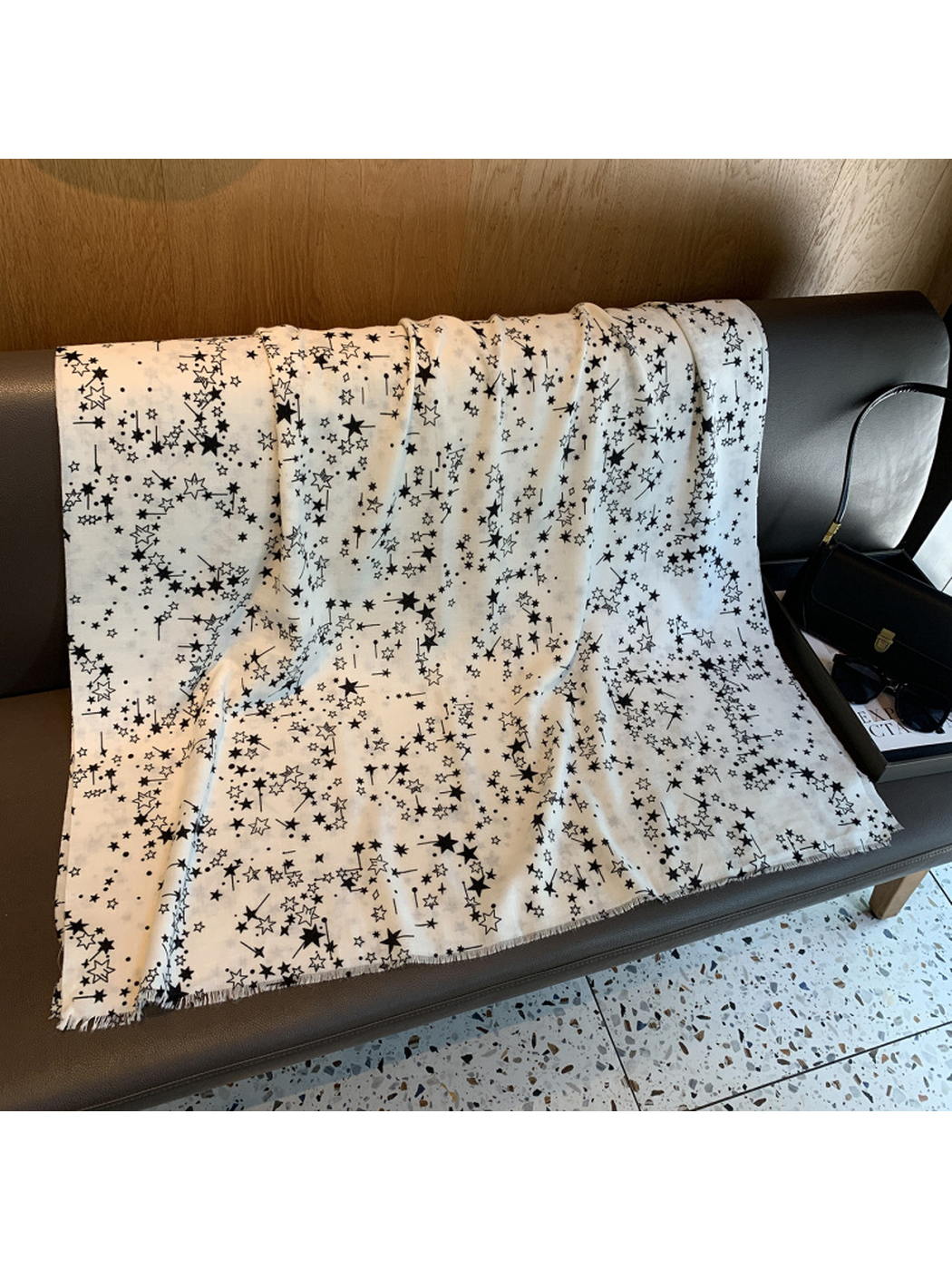 White rectangular star-print scarf spread to show its full shape