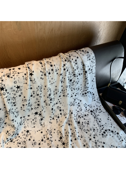 Close-up of solid and outlined stars on the White scarf
