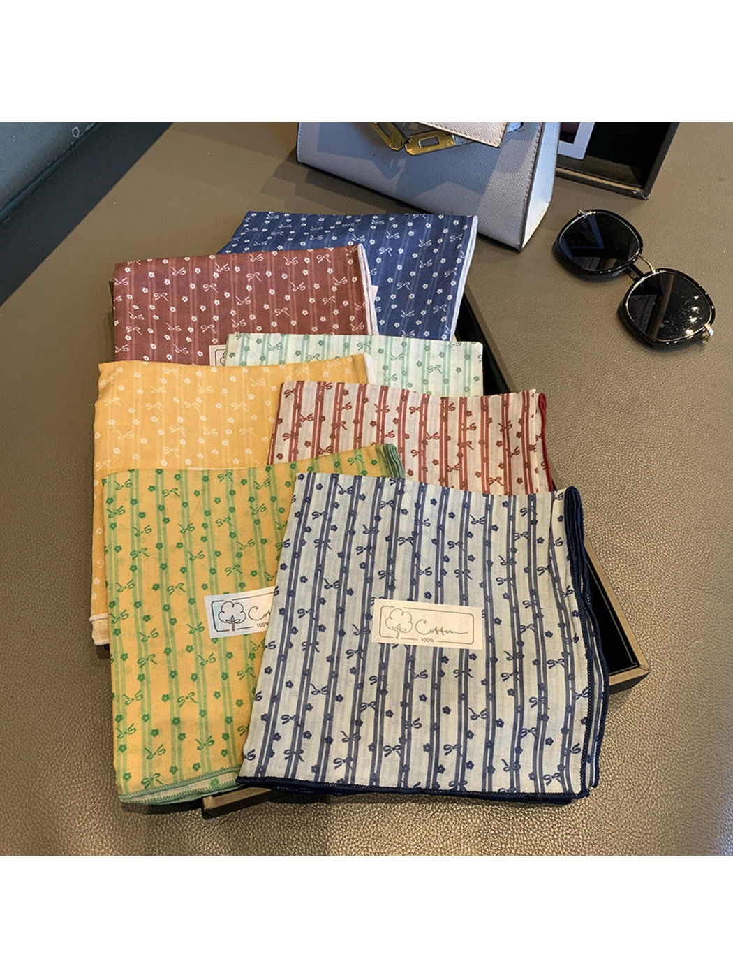 Bow and floral square scarves displayed in multiple styles