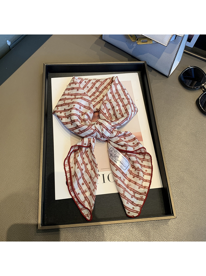 Red White bow-and-flower square scarf tied in a loose knot