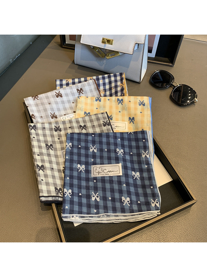 Five gingham bow-print scarf colors displayed together