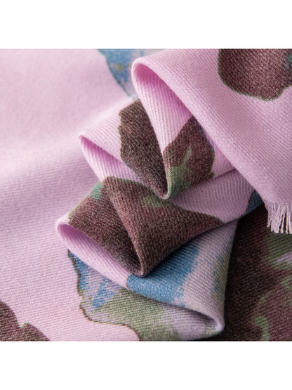 Close-up of the purple floral scarf's woven-look texture and short fringe