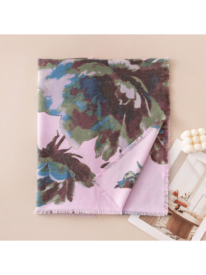 Folded purple floral scarf showing the print, reverse side and fringed edge