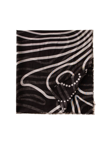 Black rectangular scarf folded to display its abstract white line pattern