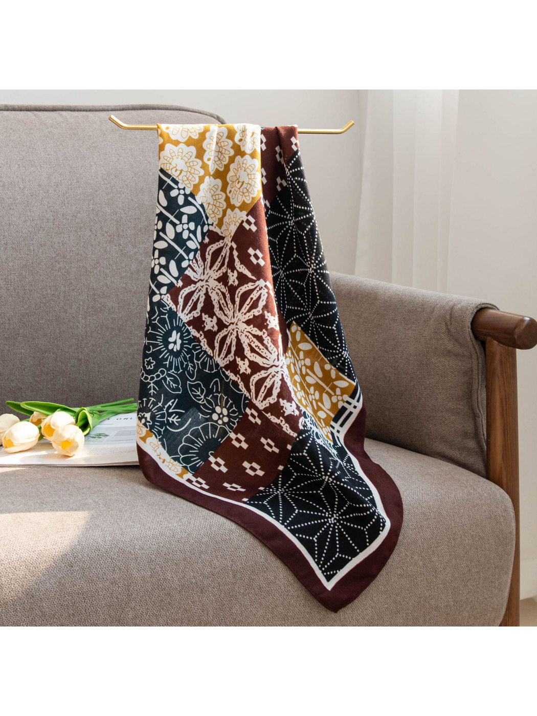 Patchwork square scarf hanging over the back of a chair