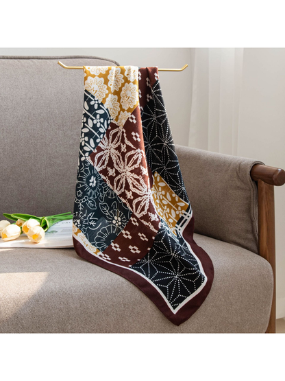Patchwork square scarf hanging over the back of a chair