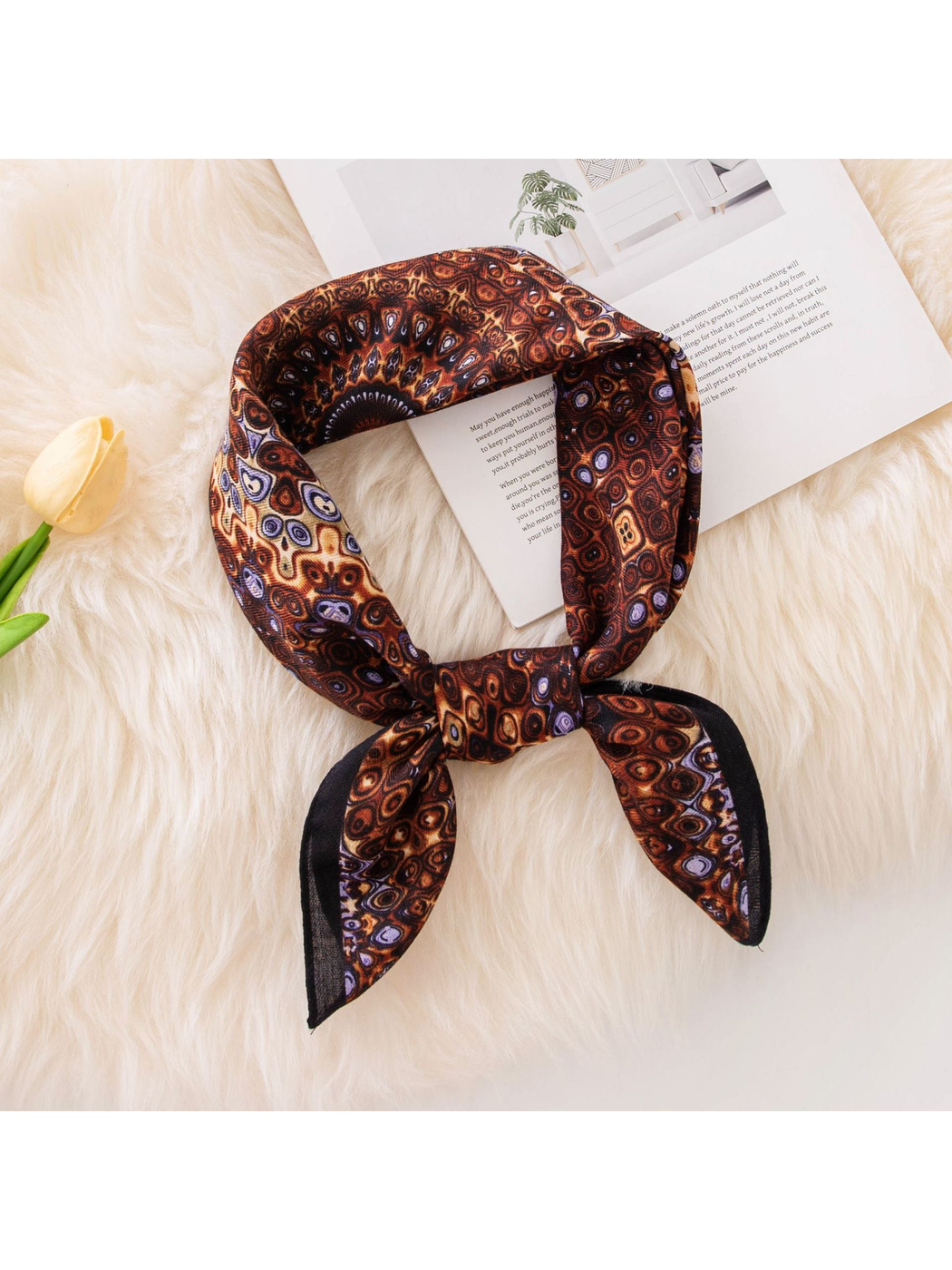 Brown square scarf tied to show its geometric medallion print
