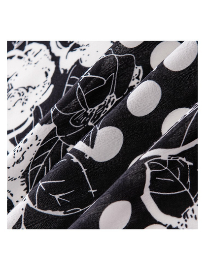 Close-up of the black and white scarf pattern and subtle woven-look texture