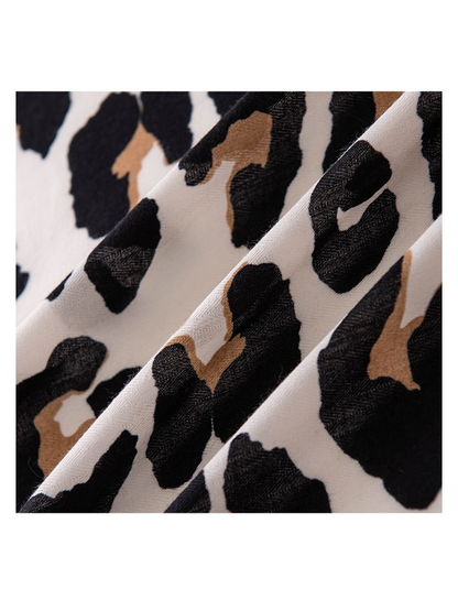 Close-up of the cow print scarf surface and fine woven-look texture
